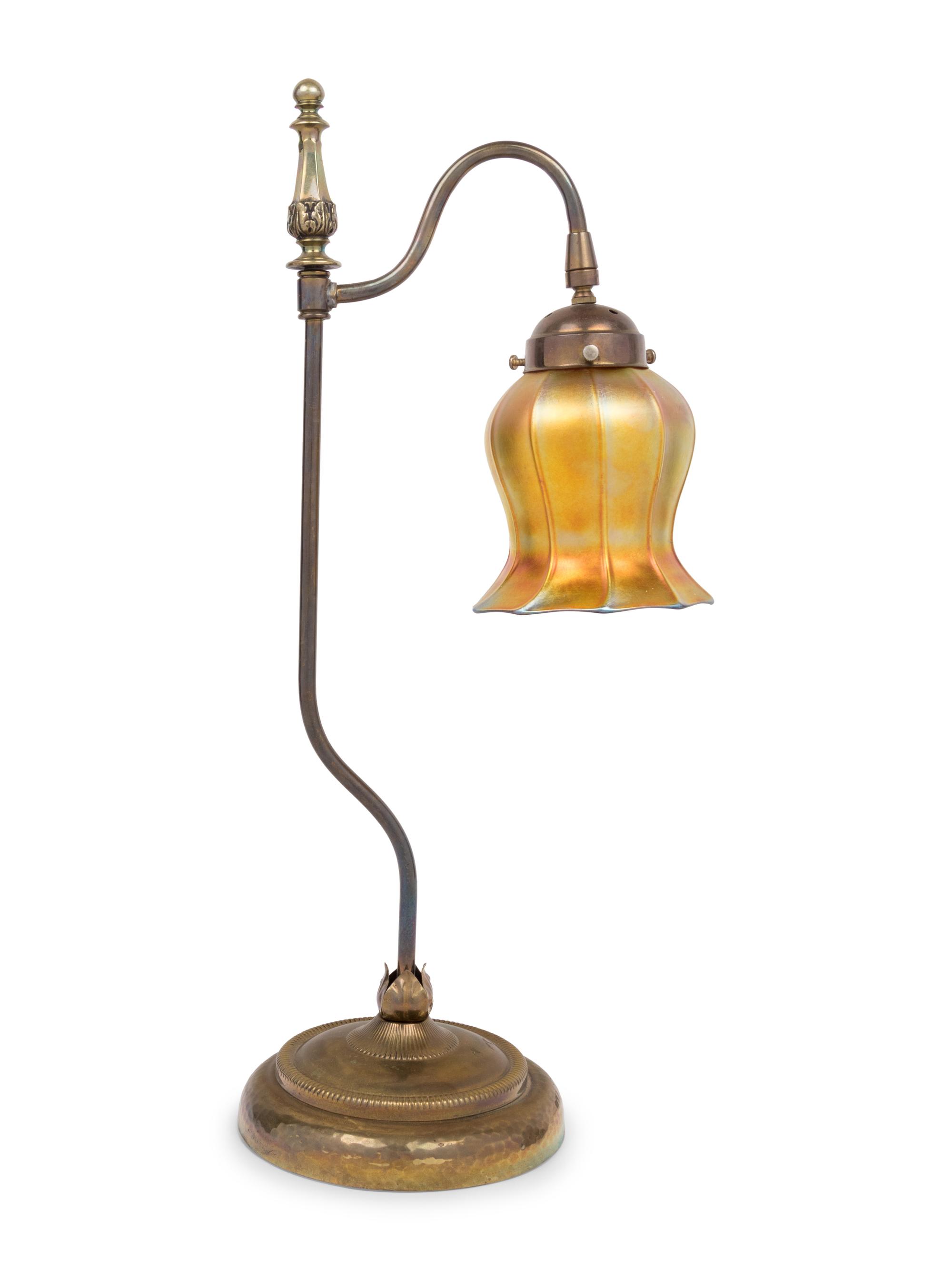 A Brass Table Lamp With Quezal Iridescent Glass Shade