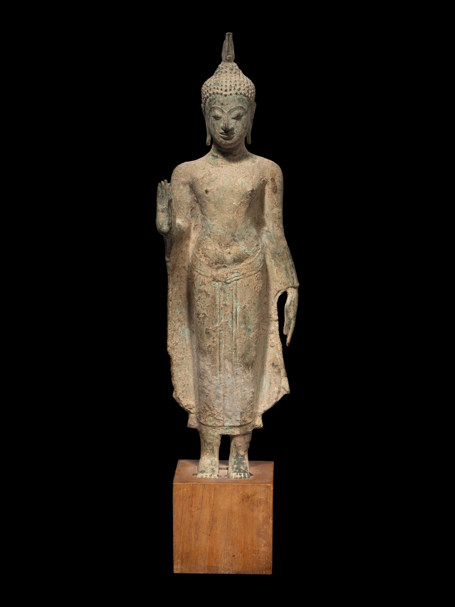 A Thai Bronze Figure of Standing Buddha and a Head of Buddha