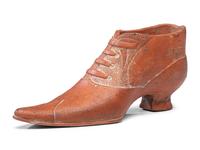 A Glazed Pottery Woman's High-Heeled Shoe