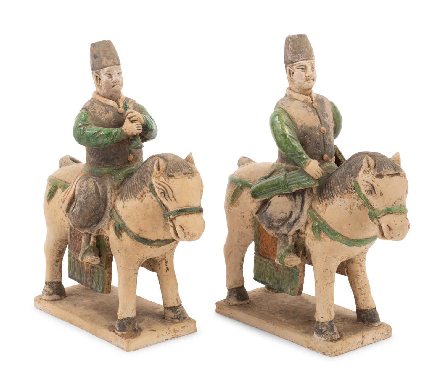 A Pair of Chinese Sancai Glazed Mounted Musician Burial Figures
