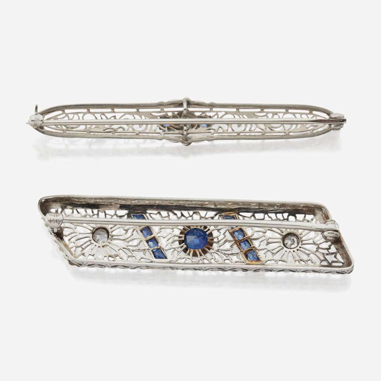A pair of Art Deco white gold and diamond brooches