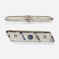 A pair of Art Deco white gold and diamond brooches