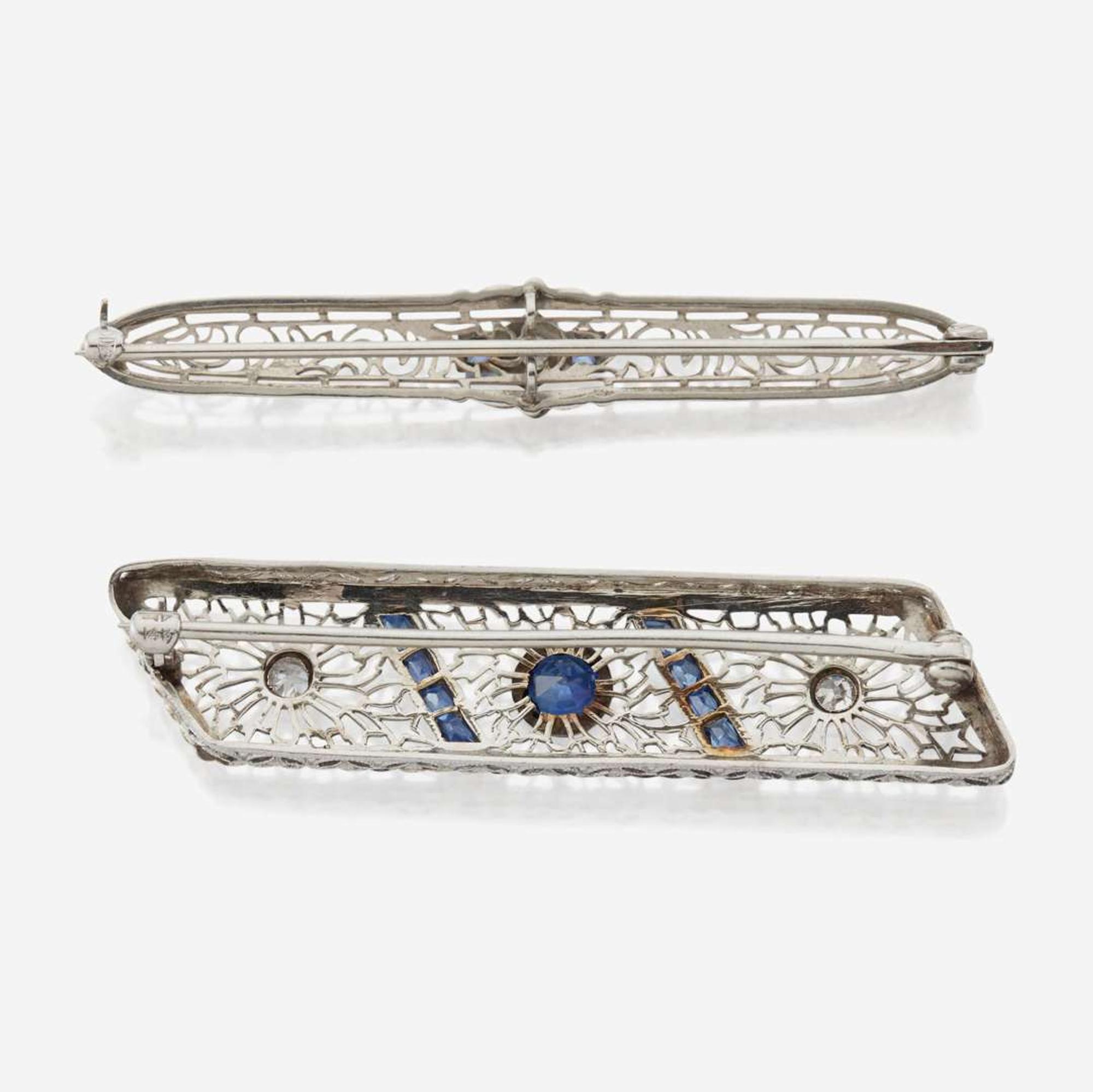 A pair of Art Deco white gold and diamond brooches