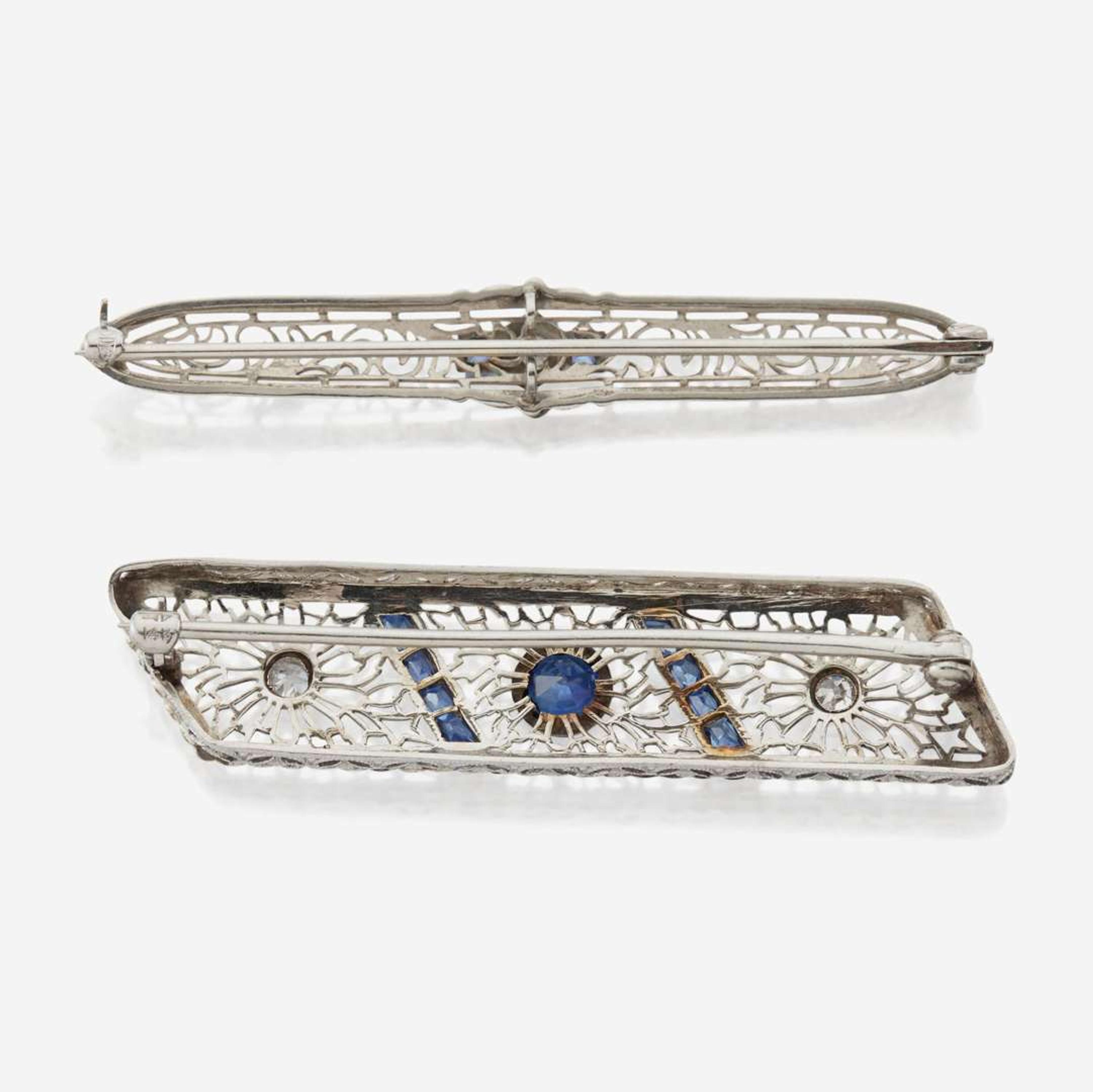 A pair of Art Deco white gold and diamond brooches
