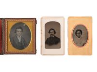 [EARLY PHOTOGRAPHY]. A group of 3 photographs, incl. a daguerreotype of a young man of mixed race.