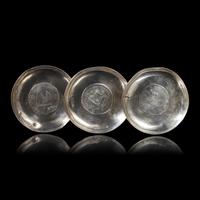 A Group of Seven Chinese Silver Coin-Mounted Small Dishes, 20th Century — 近代 銀嵌機制幣小碟一組七件