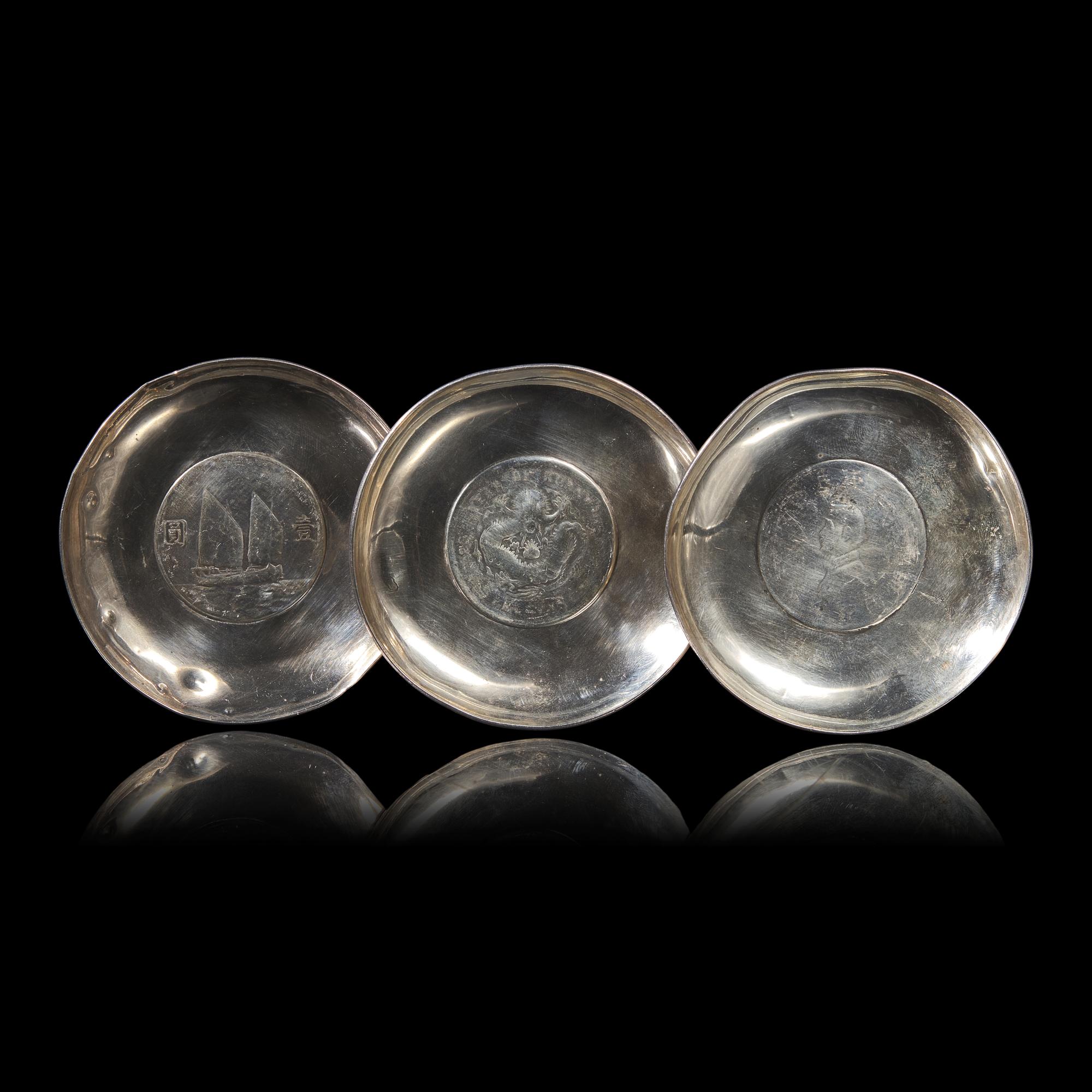 A Group of Seven Chinese Silver Coin-Mounted Small Dishes, 20th Century — 近代 銀嵌機制幣小碟一組七件