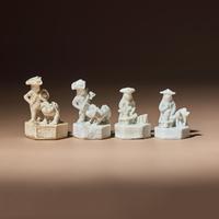 Four Miniature Chinese Blanc-de-Chine Porcelain 'European' Whistles, Late 17th-Early 18th Century — 清中期 德化白瓷西人鬥獸哨四件