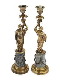 A Pair of French Bronze Figural Candlesticks on Marble Bases