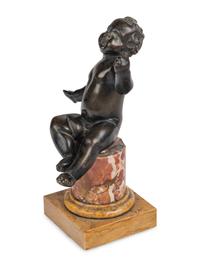 An Italian Bronze Figure of a Putto
