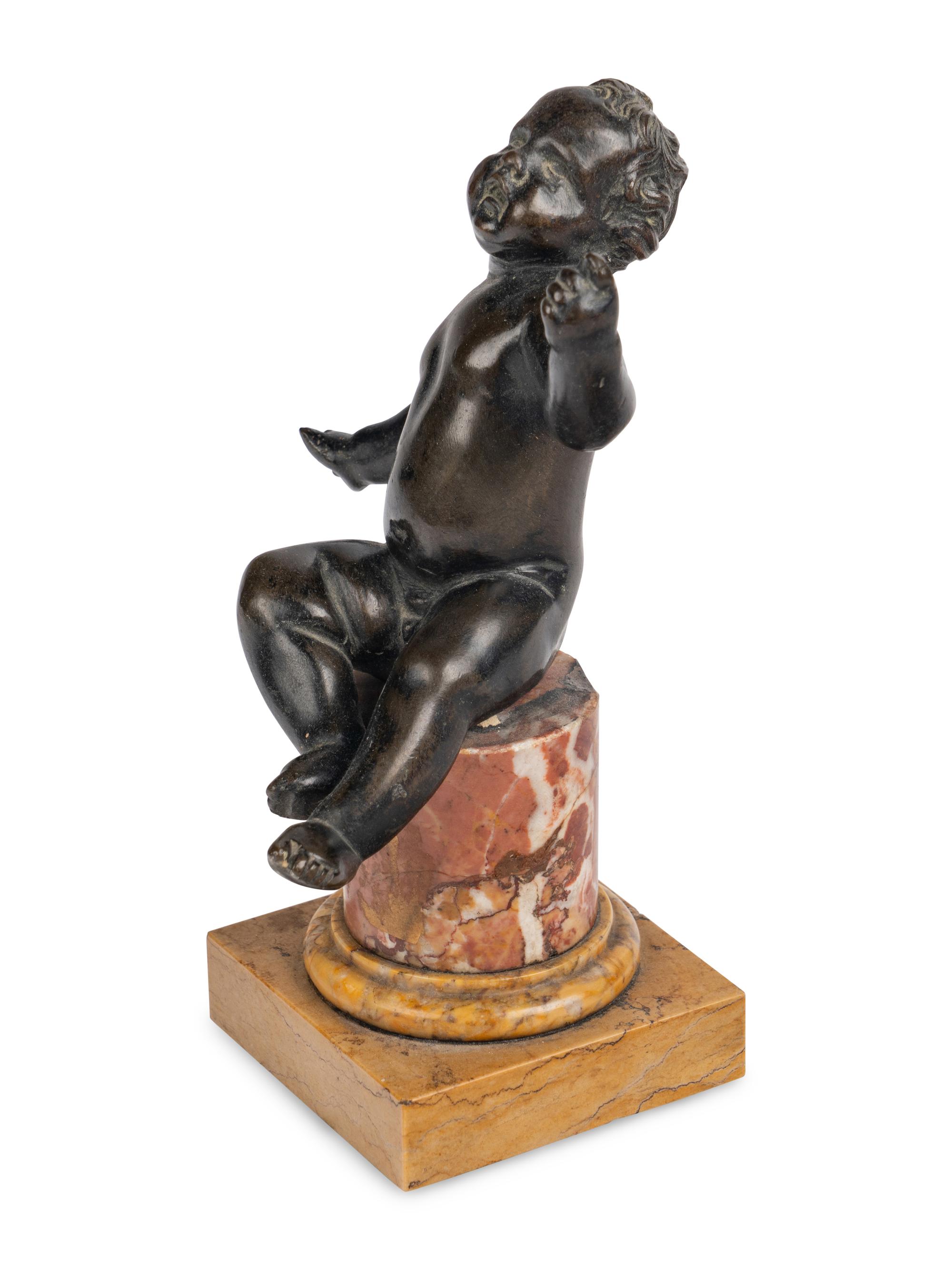 An Italian Bronze Figure of a Putto
