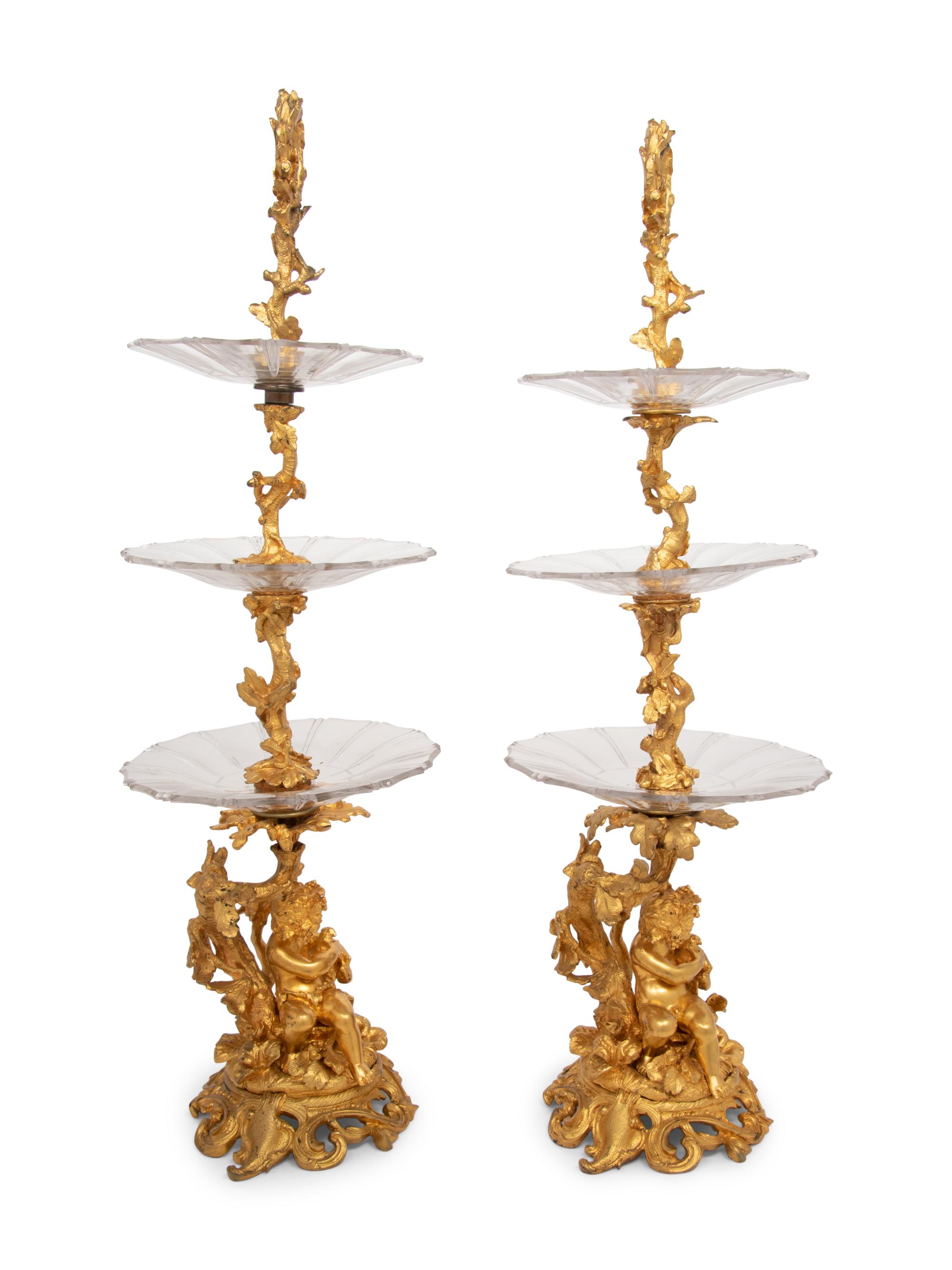 A Pair of French Gilt Bronze and Glass Three-Tier Stands