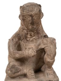 An Asian Carved Stone Seated Figure