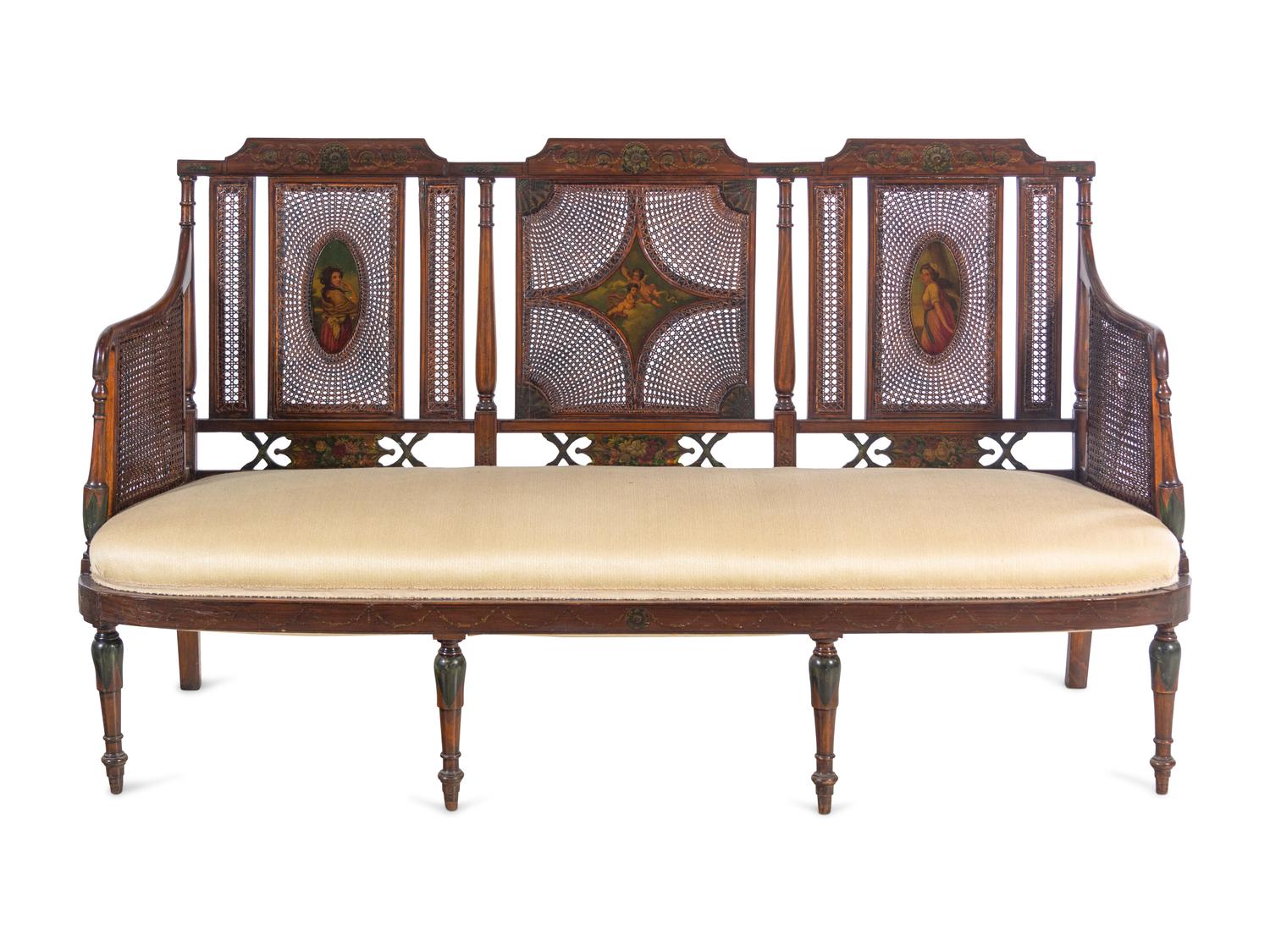 An Edwardian Painted Satinwood Caned Settee
