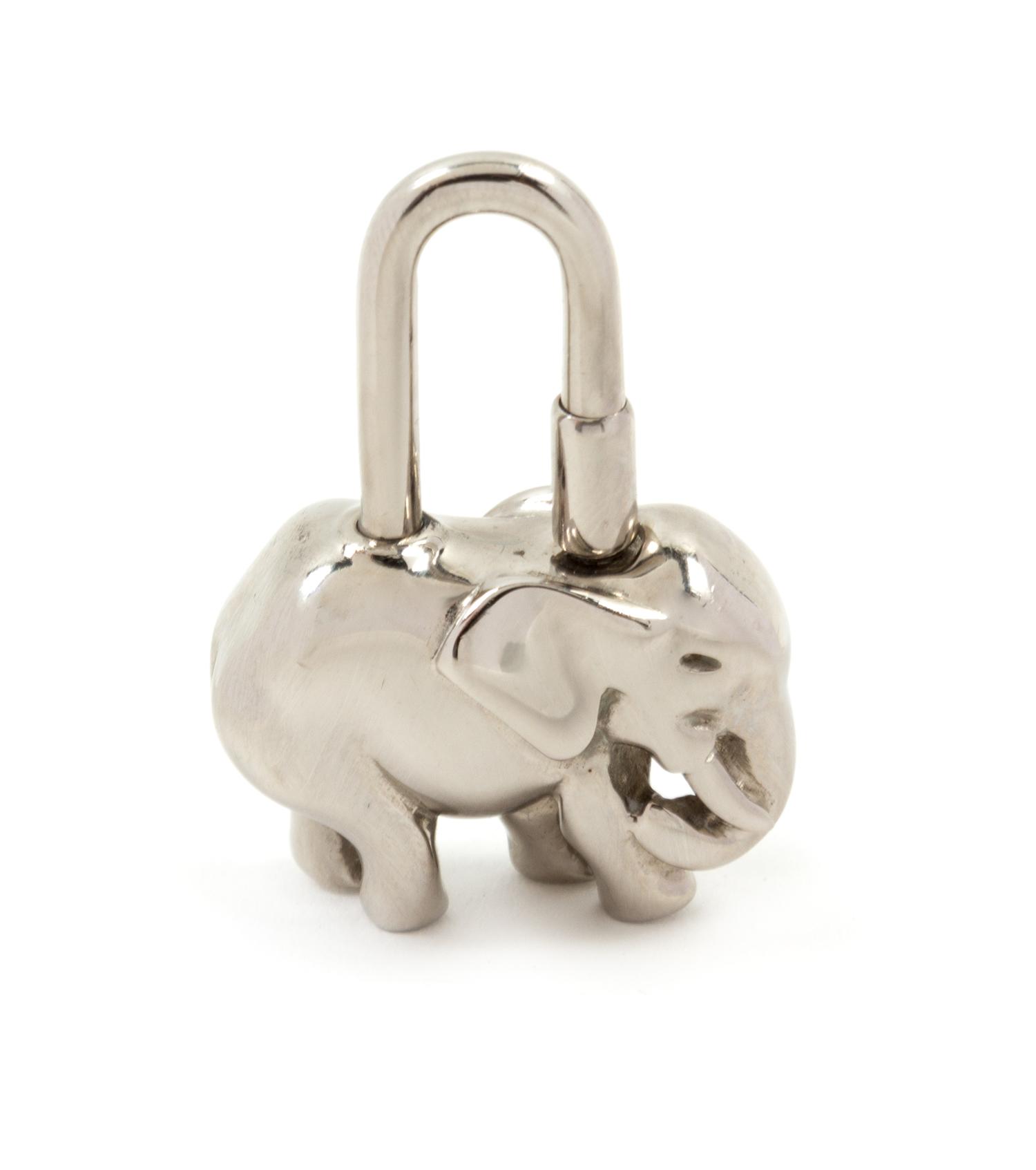 An Hermès Palladium Cadena Elephant Lock Charm, 1" x 1.5".