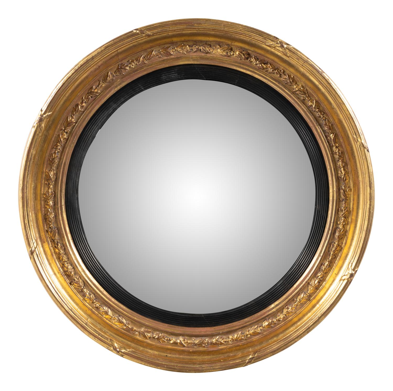 A Regency Giltwood and Parcel Ebonized Mirror