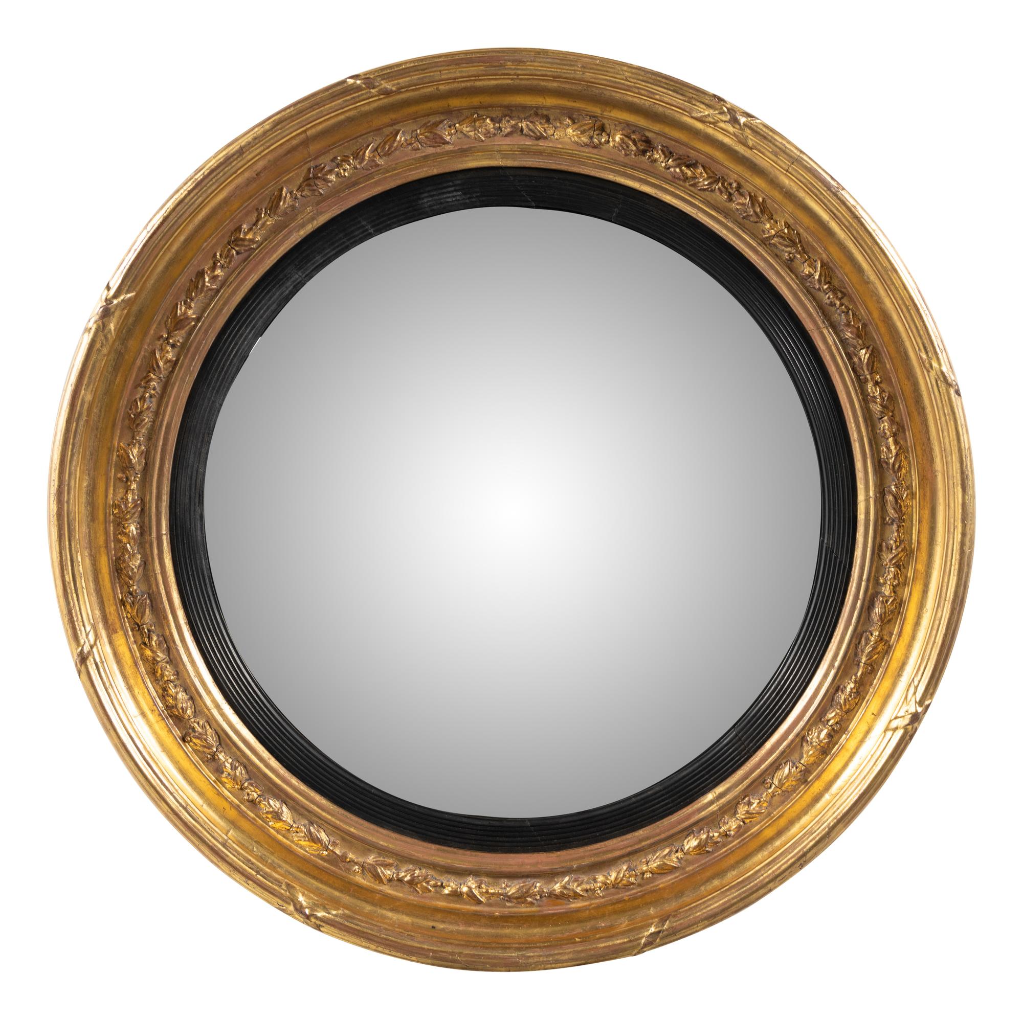 A Regency Giltwood and Parcel Ebonized Mirror