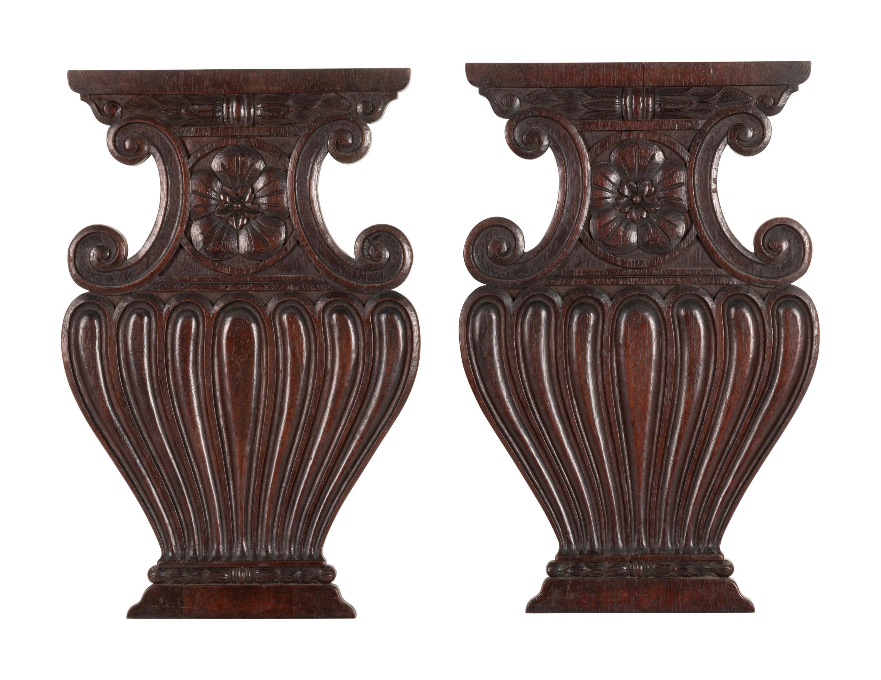 A Pair of Renaissance Revival Carved Walnut Urn-Form Panels