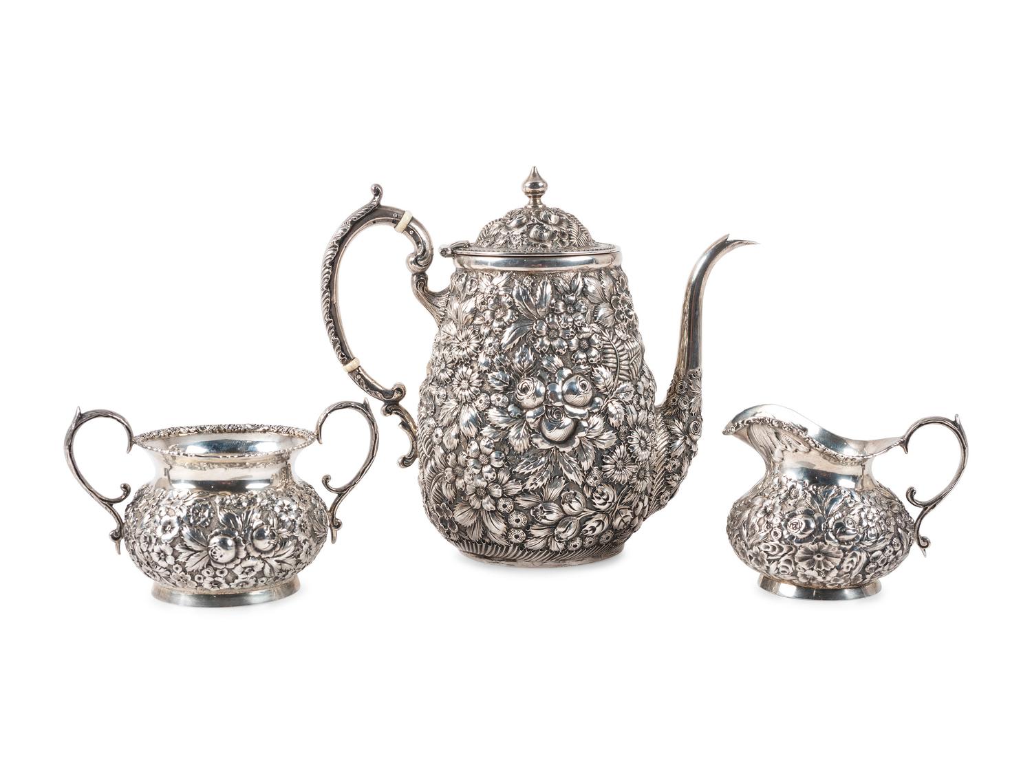 A Repousse Silver Three-Piece Tea Service