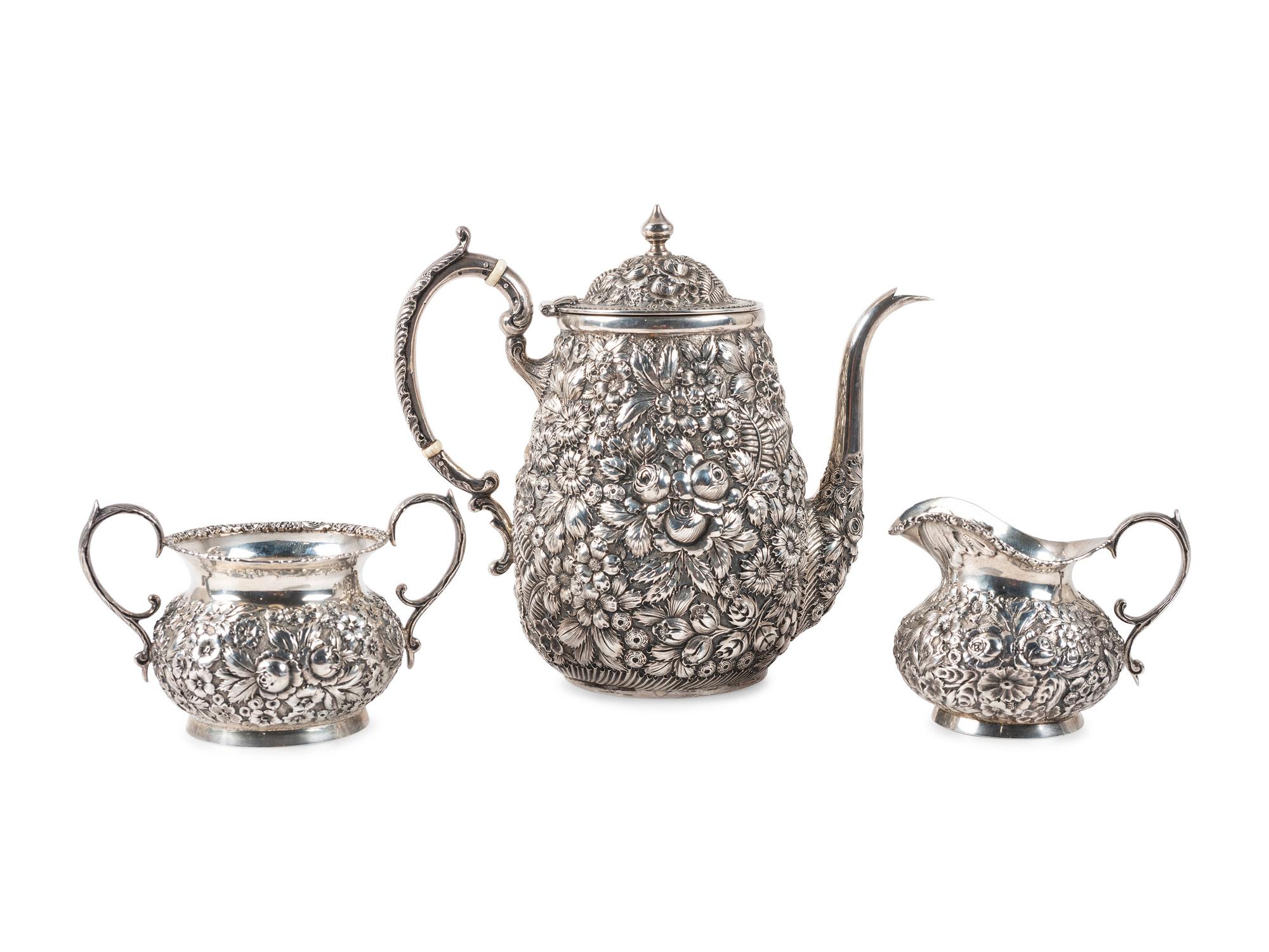 A Repousse Silver Three-Piece Tea Service