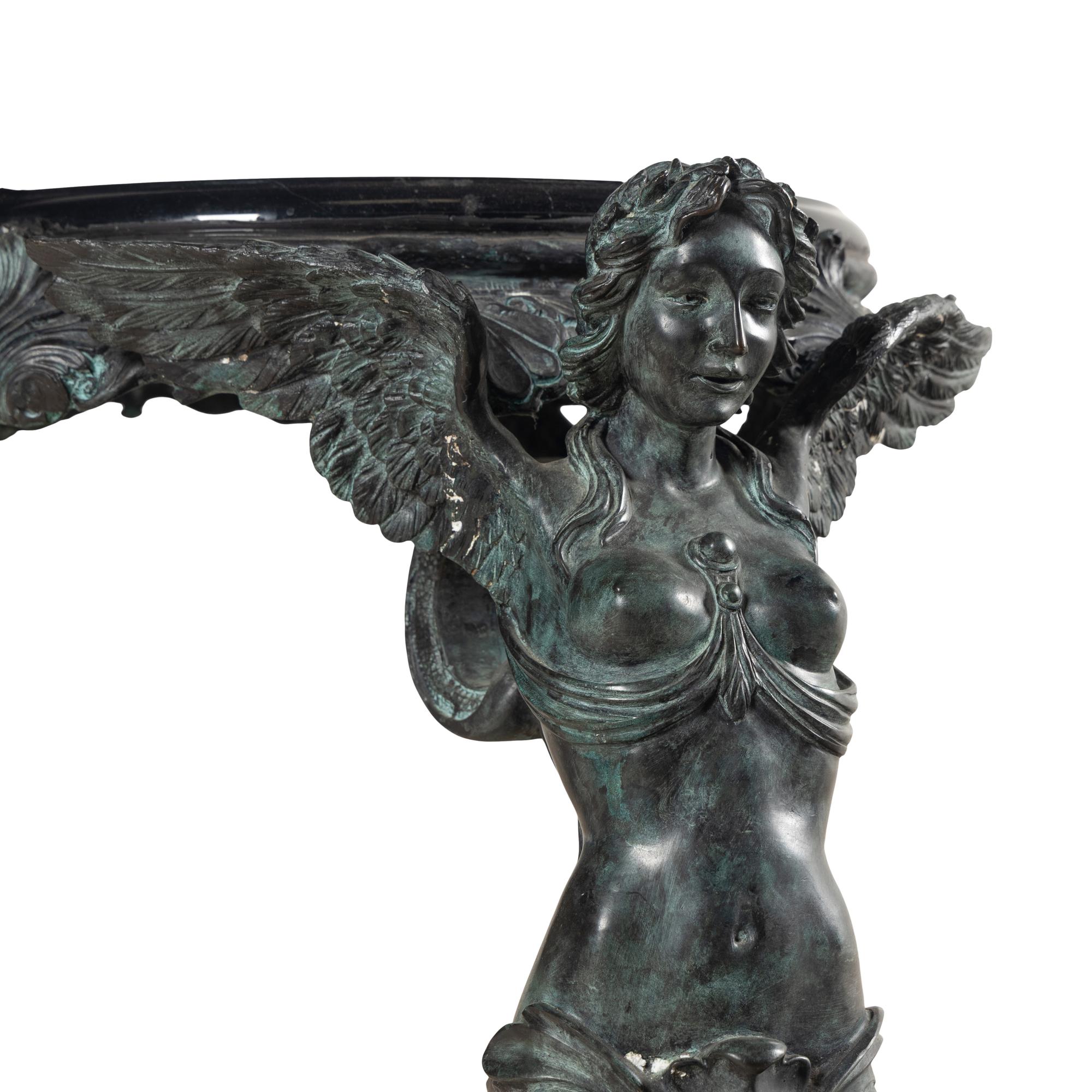 A Patinated Bronze and Marble Center Table