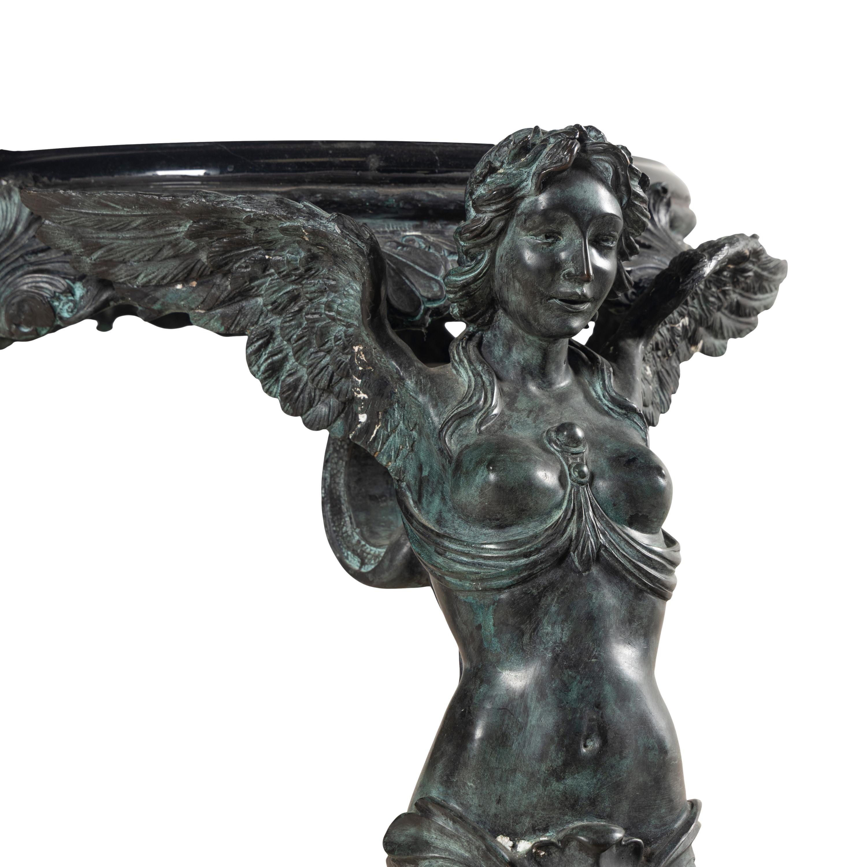 A Patinated Bronze and Marble Center Table