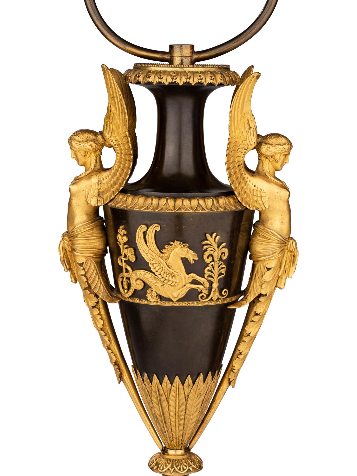 A Pair of Directoire Ormolu and Patinated Bronze Urns