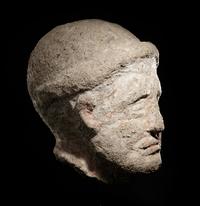 An Etruscan Over-Lifesized Nenfro Portrait Head of a Man