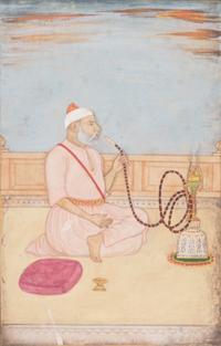A Miniature Mughal Painting of a Hookah Smoker Image 7 x 4 1/2 inches. — 18TH CENTURY