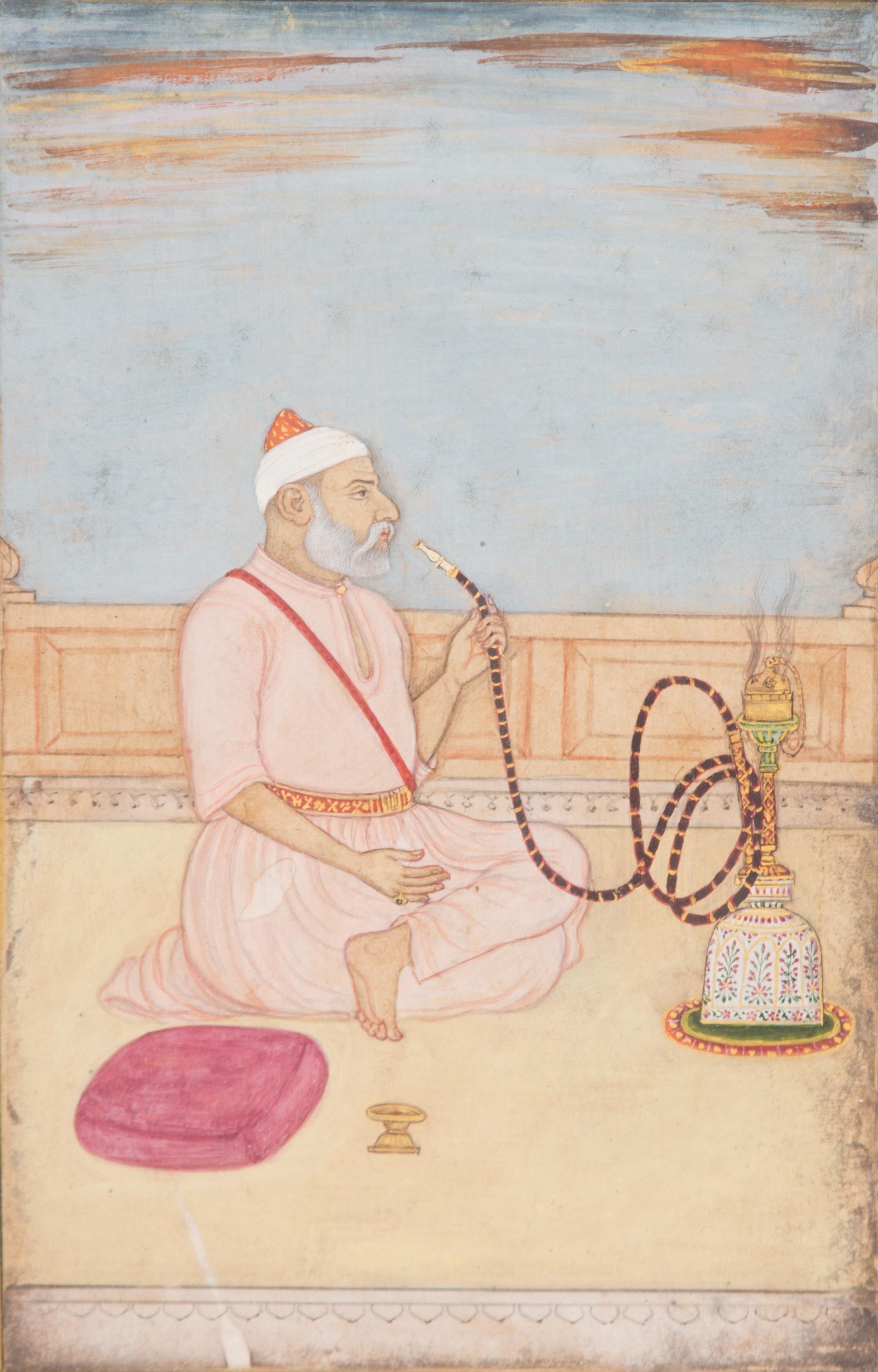 A Miniature Mughal Painting of a Hookah Smoker Image 7 x 4 1/2 inches. — 18TH CENTURY
