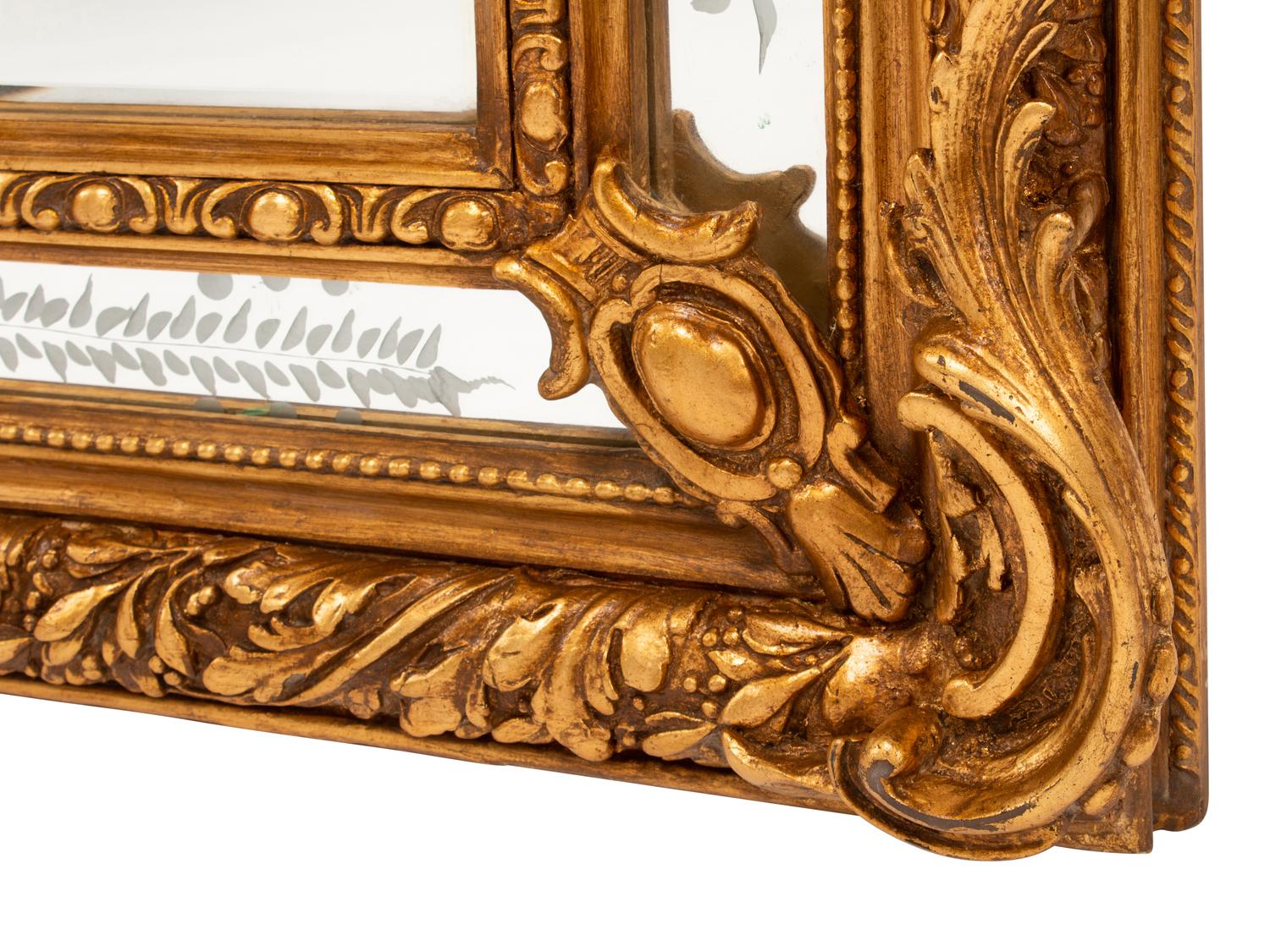 A Pair of Louis XV Style Gilt and Engraved Mirrors