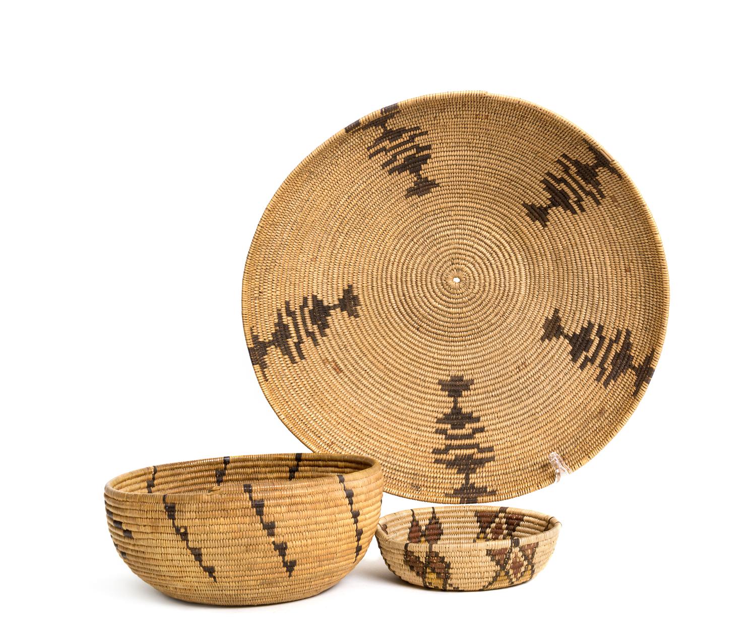 Three California Baskets Height of largest 3 3/4 x diameter 12 1/2 inches.