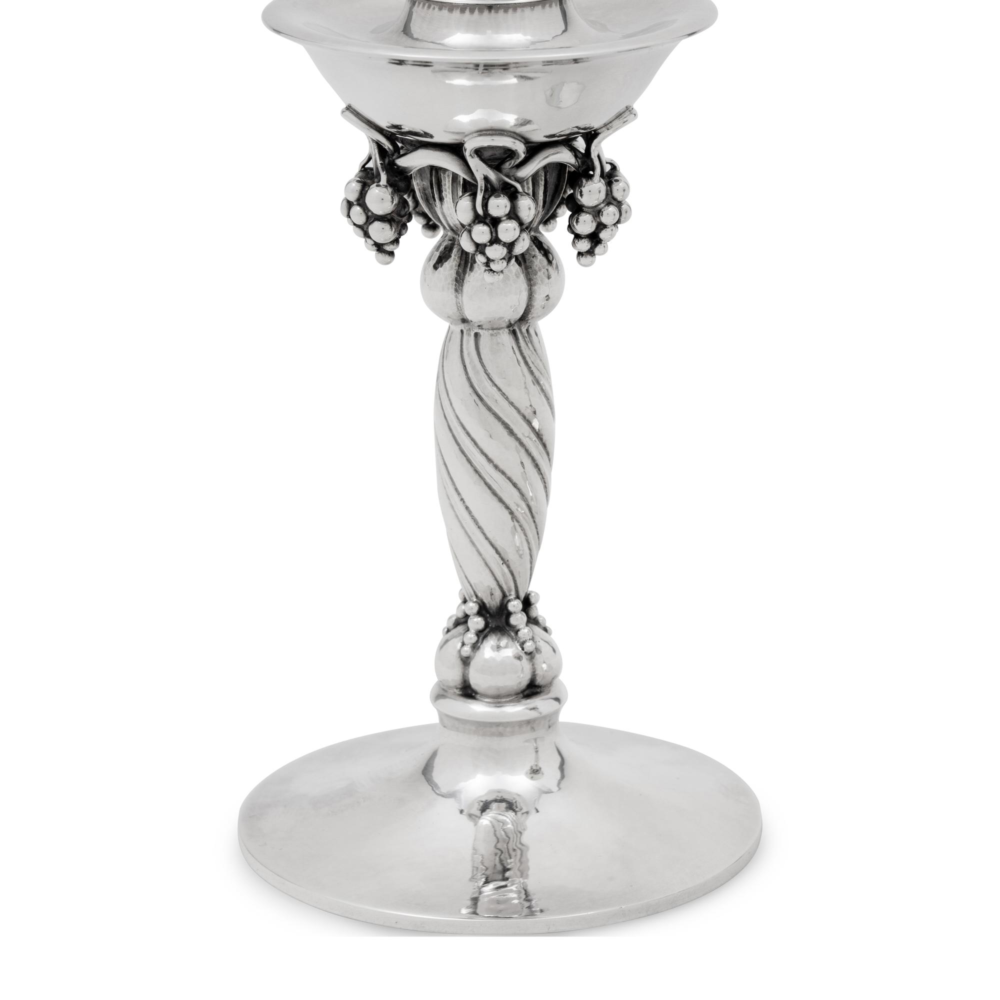 A Pair of Georg Jensen Silver Grape Candlesticks