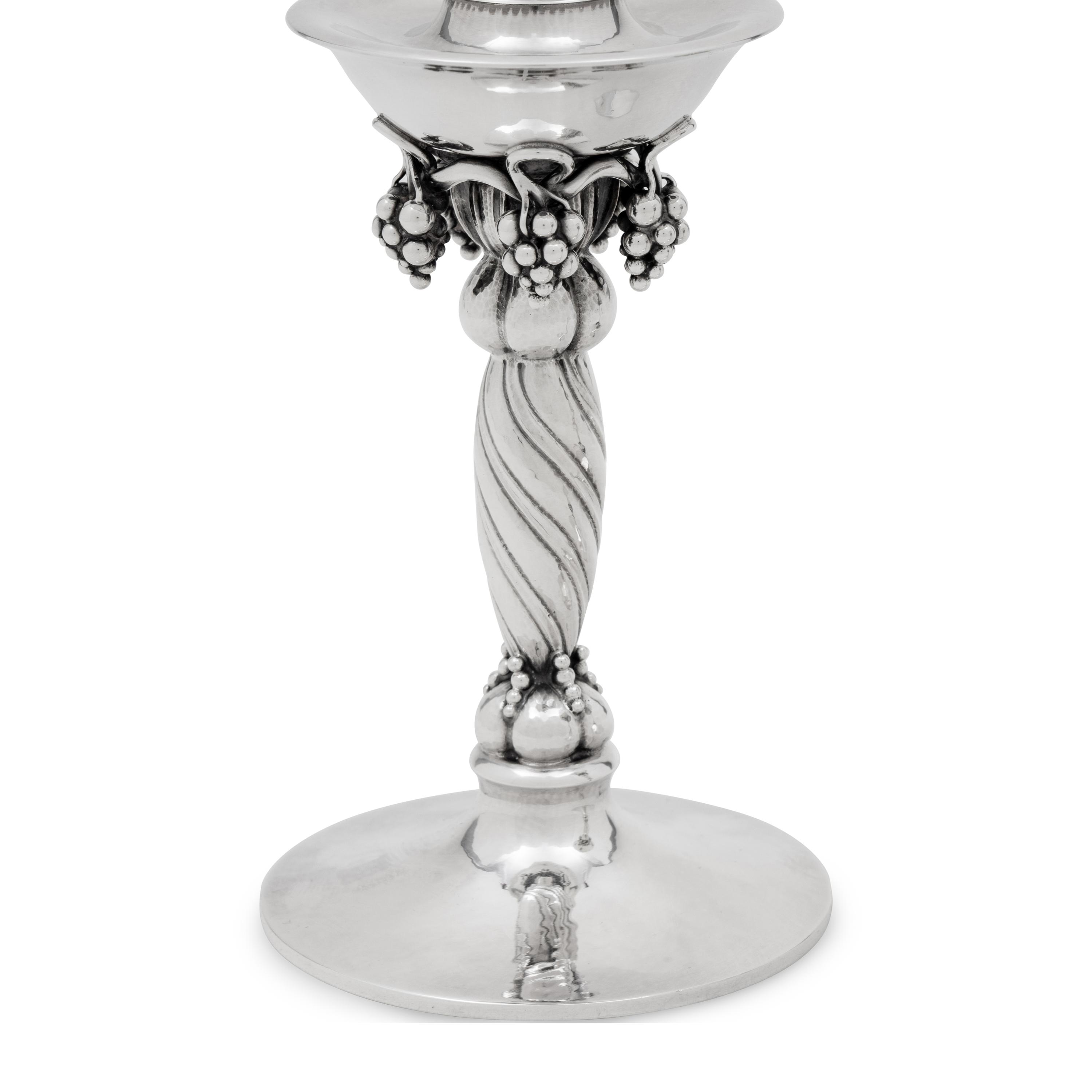 A Pair of Georg Jensen Silver Grape Candlesticks