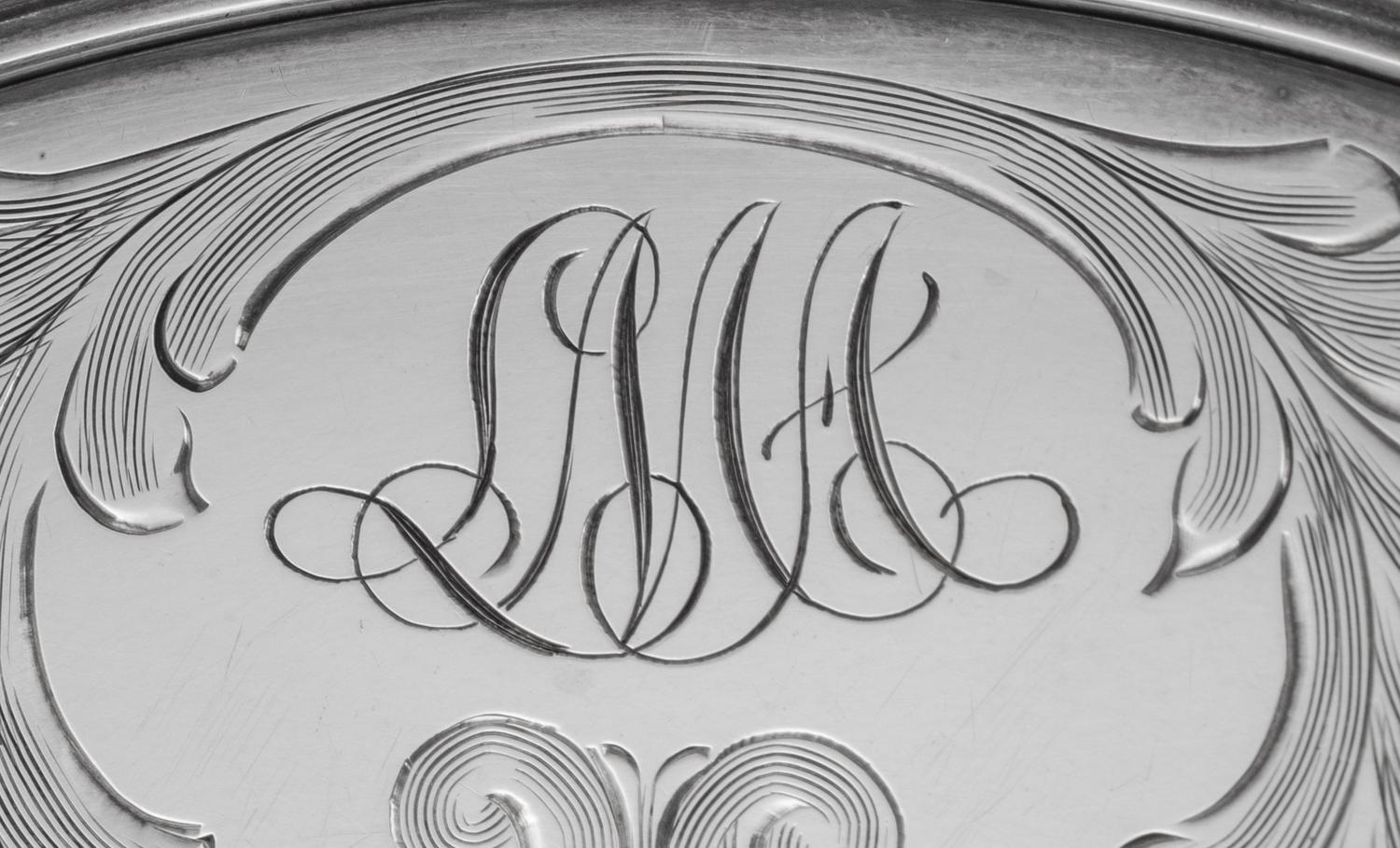 A Set of Twelve American Silver Teacups and Saucers