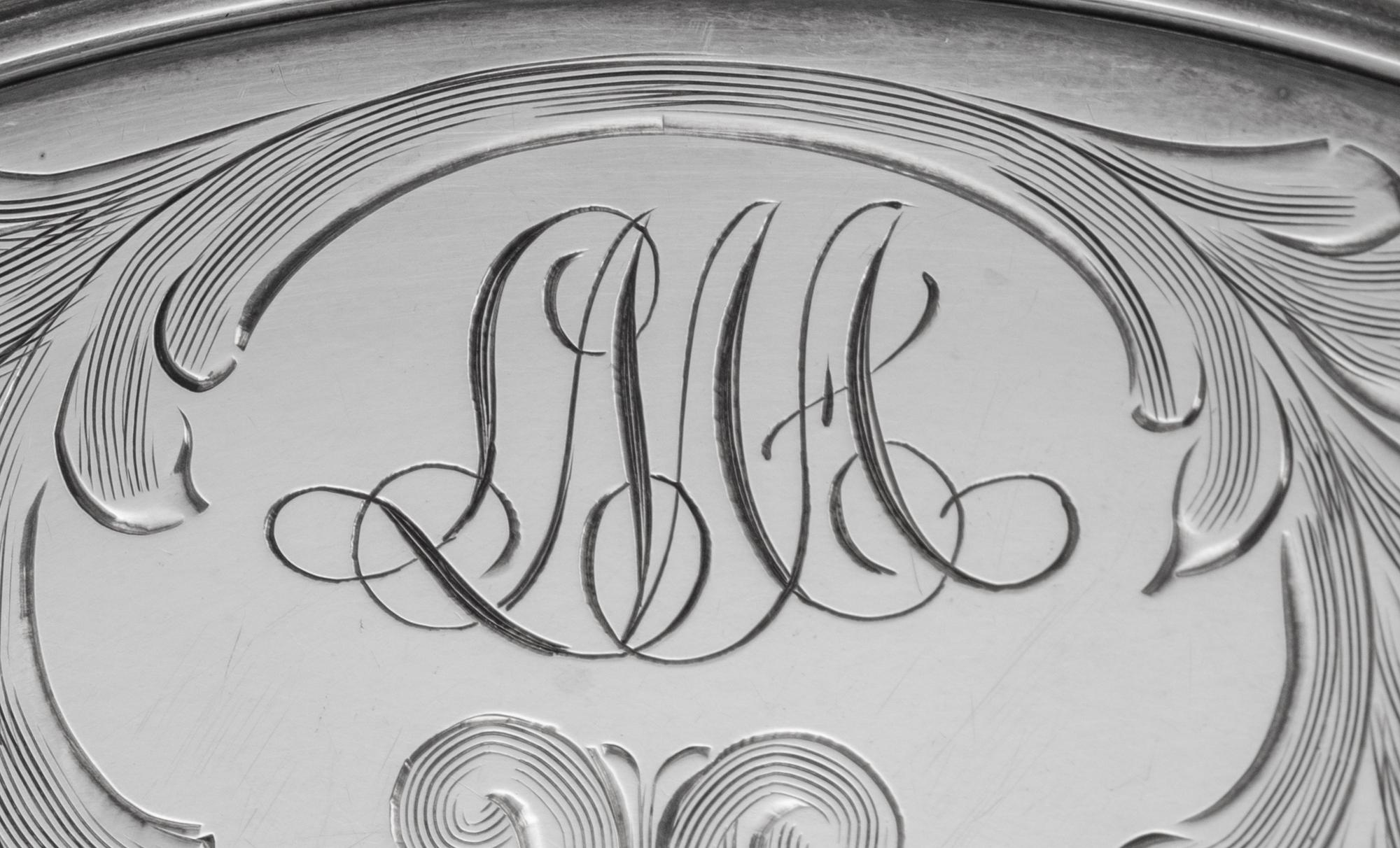 A Set of Twelve American Silver Teacups and Saucers