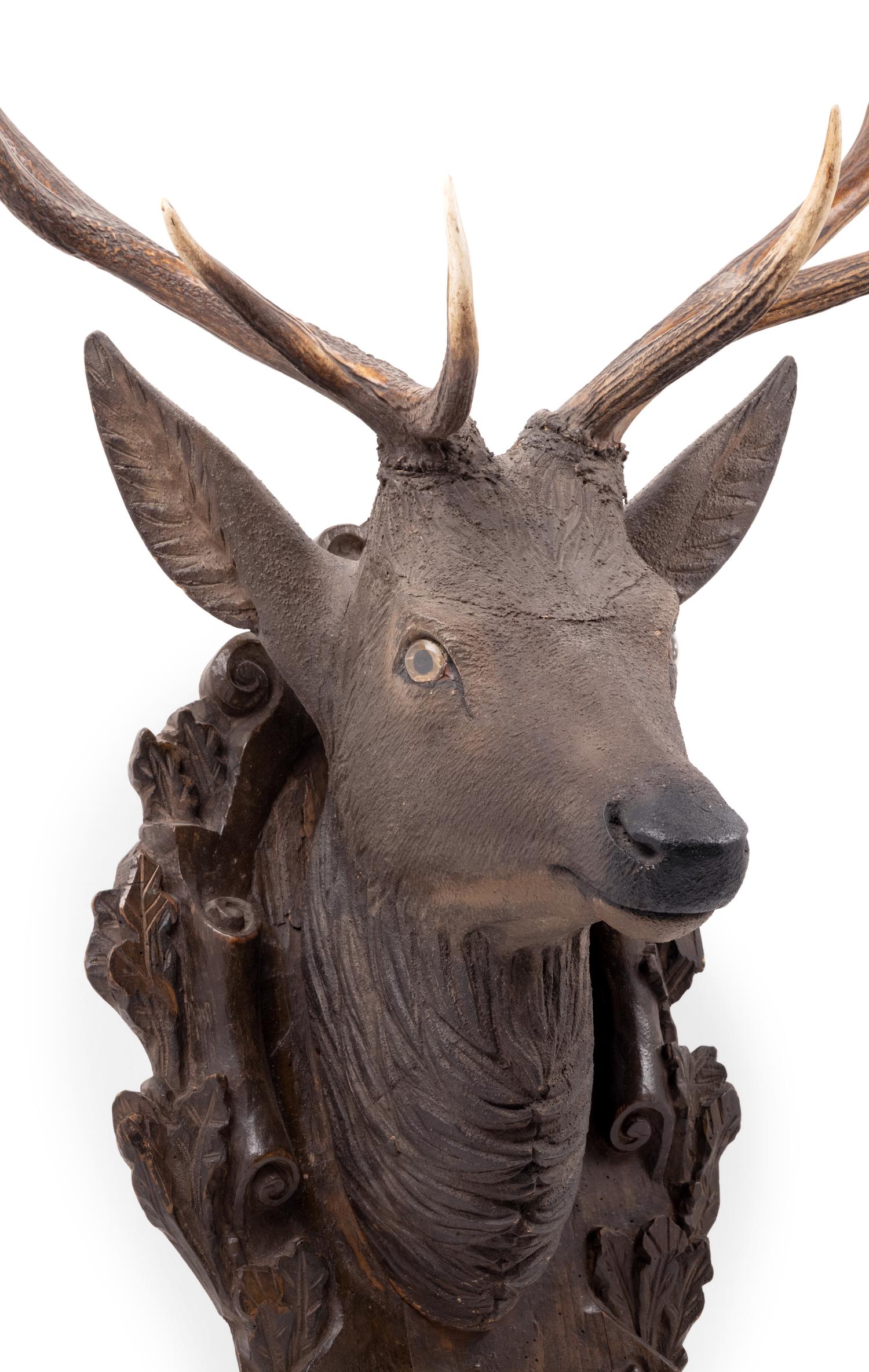A Black Forest Carved Stag Head