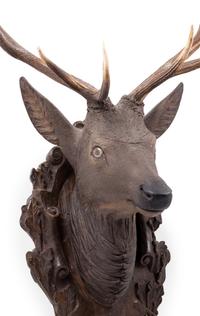 A Black Forest Carved Stag Head