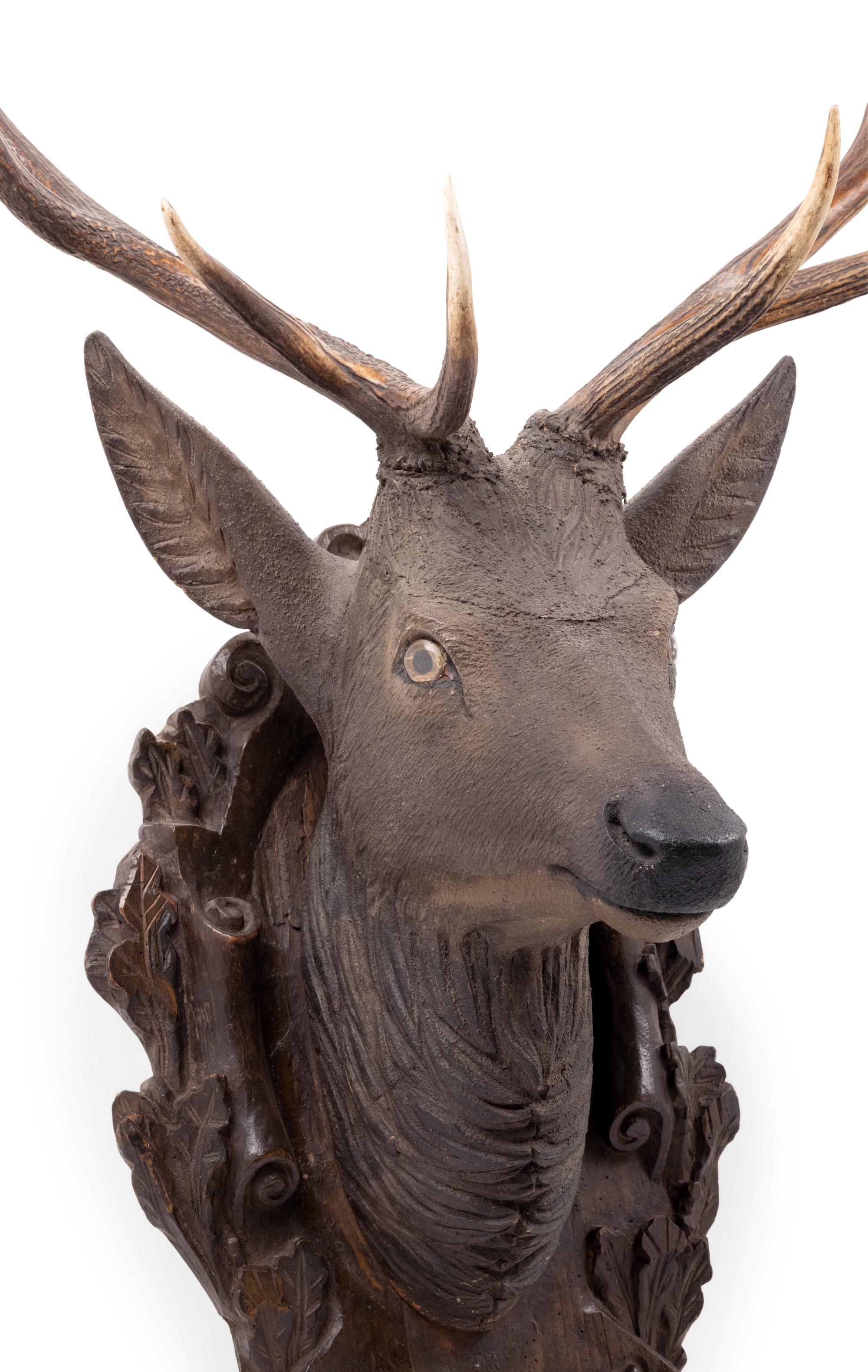 A Black Forest Carved Stag Head