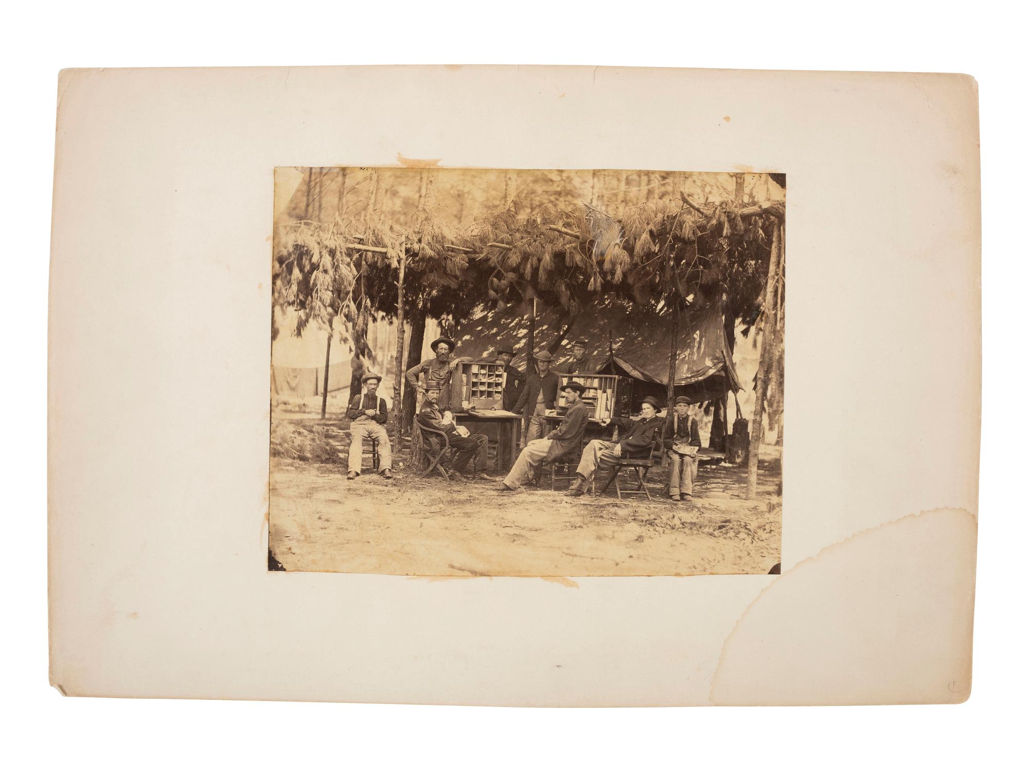 Civil War [O'SULLIVAN, Timothy (1840-1882), photographer]. Soldiers at the Chief Ambulance Officer Quarters, IX Army Corps . [Petersburg, VA]: [1864].