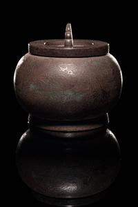 An Incised Silver Covered Jar