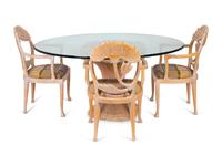 A Hollywood Regency Style Dining Table and Chairs — 20TH CENTURY