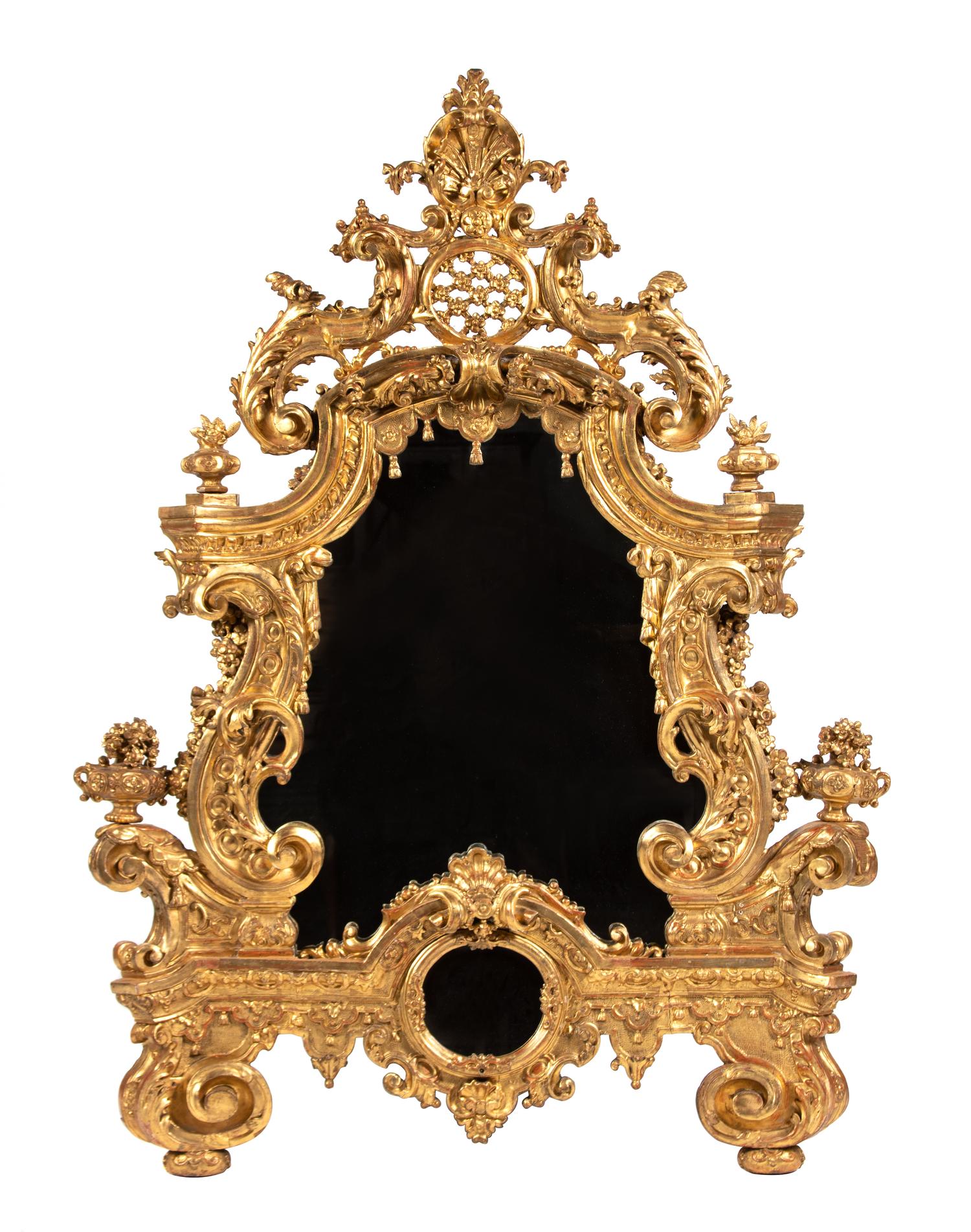 An Elaborate Rococo Style Giltwood Mirror