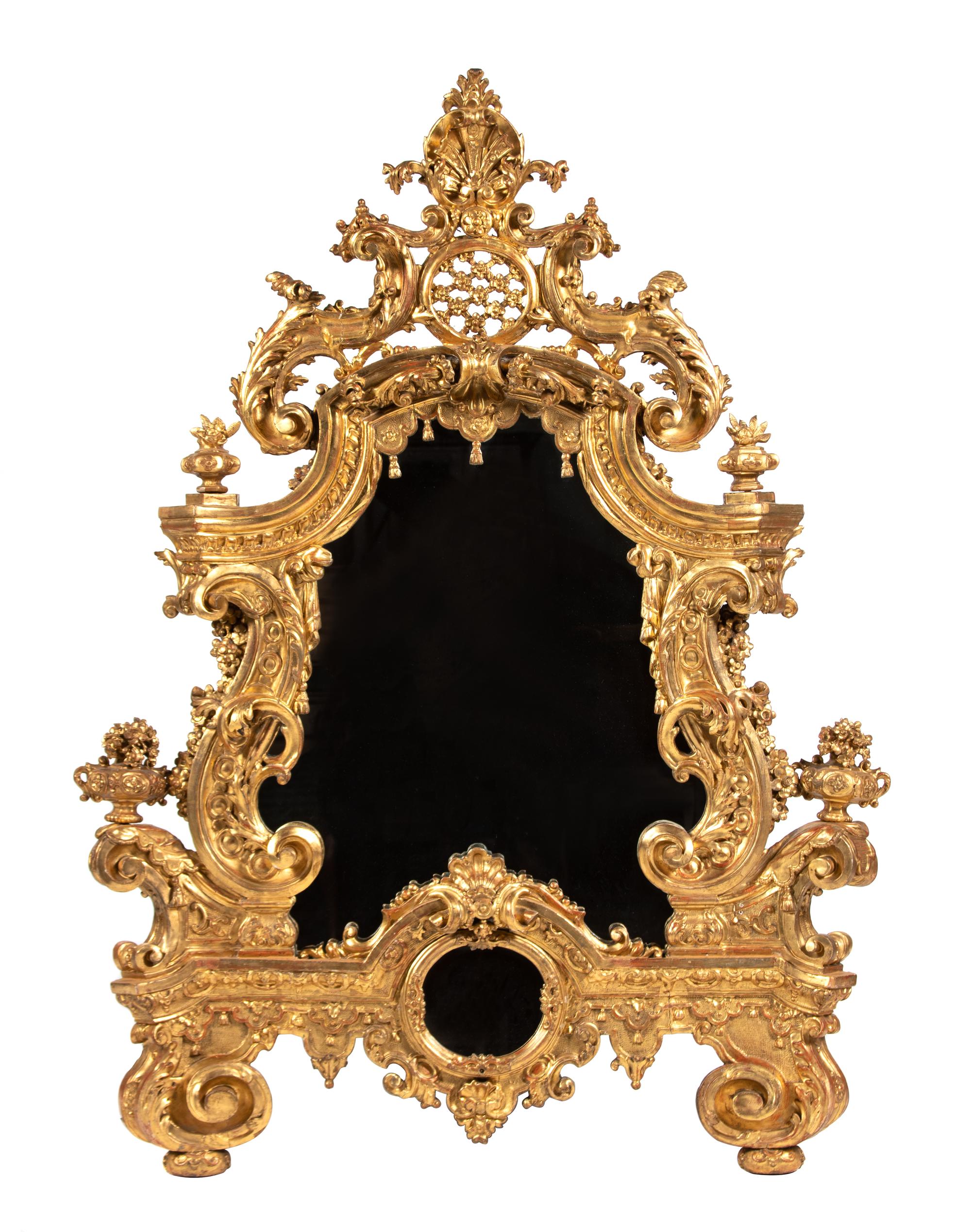 An Elaborate Rococo Style Giltwood Mirror