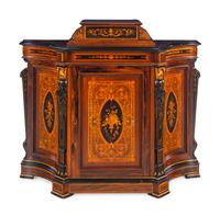 A Victorian Parcel Gilt, Ebonized and Inlaid Rosewood Parlor Cabinet