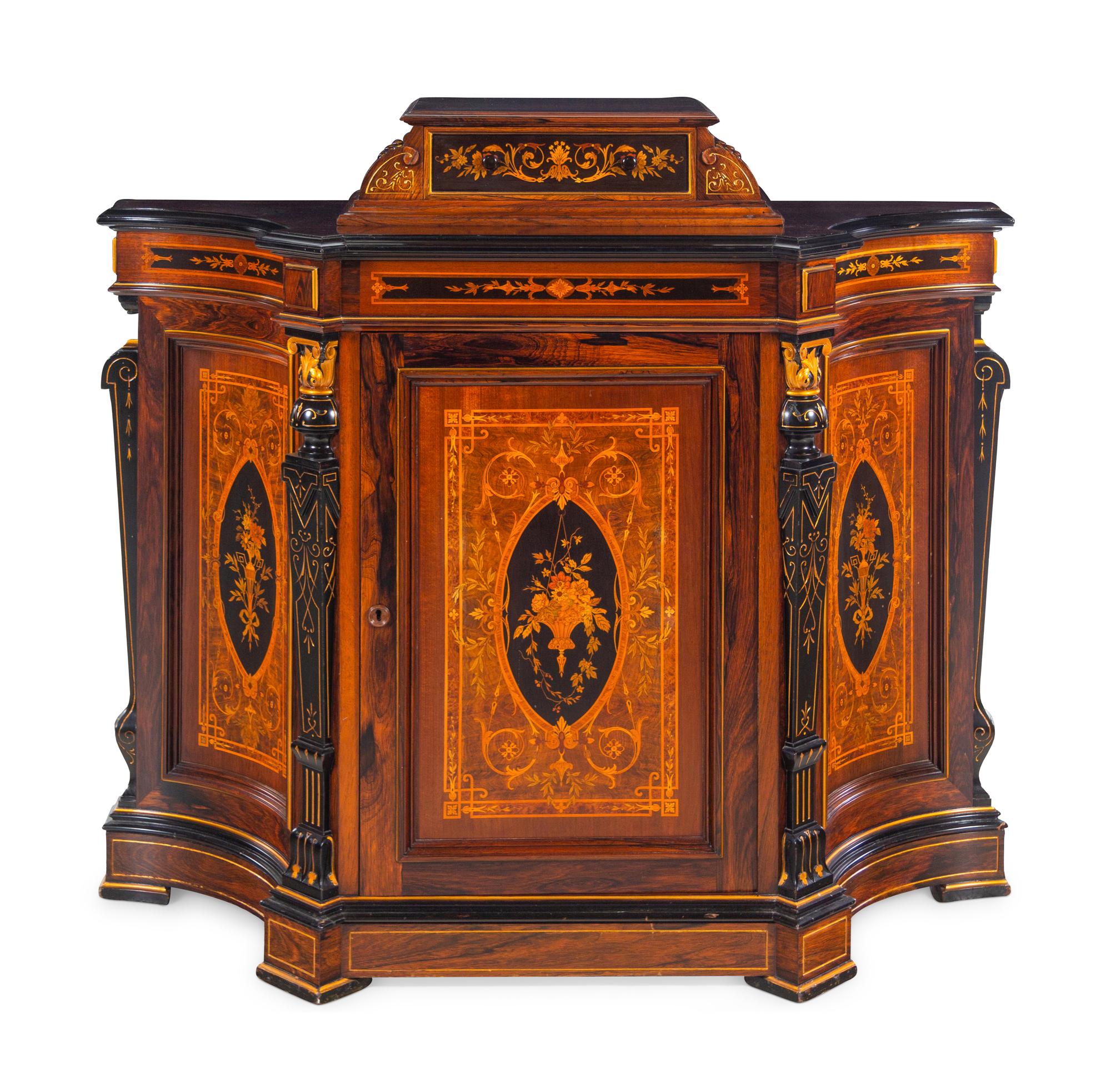 A Victorian Parcel Gilt, Ebonized and Inlaid Rosewood Parlor Cabinet