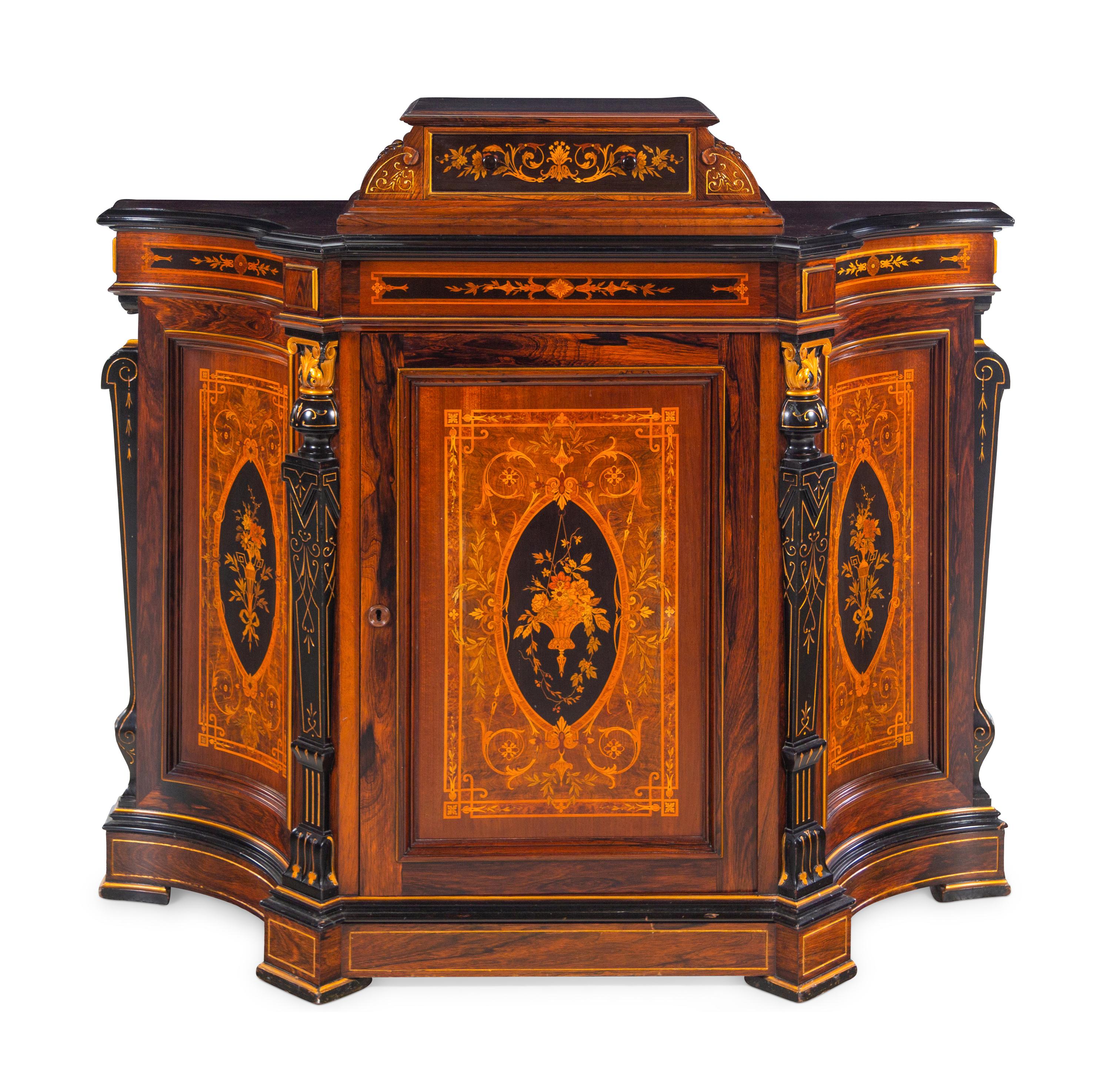 A Victorian Parcel Gilt, Ebonized and Inlaid Rosewood Parlor Cabinet