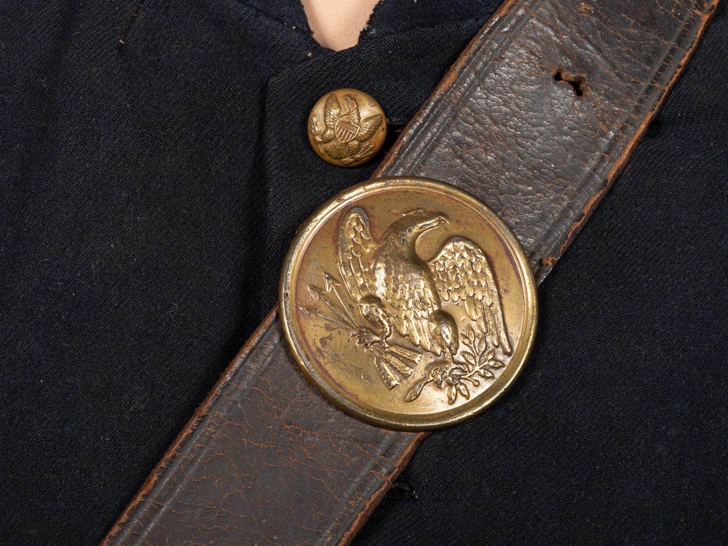 [CIVIL WAR]. A collection of items attributed to Thomas W. Johnson, Co. K, 4th Delaware Infantry, incl. frock coat, cap, belt rig, and cartridge box.