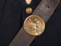 [CIVIL WAR]. A collection of items attributed to Thomas W. Johnson, Co. K, 4th Delaware Infantry, incl. frock coat, cap, belt rig, and cartridge box.