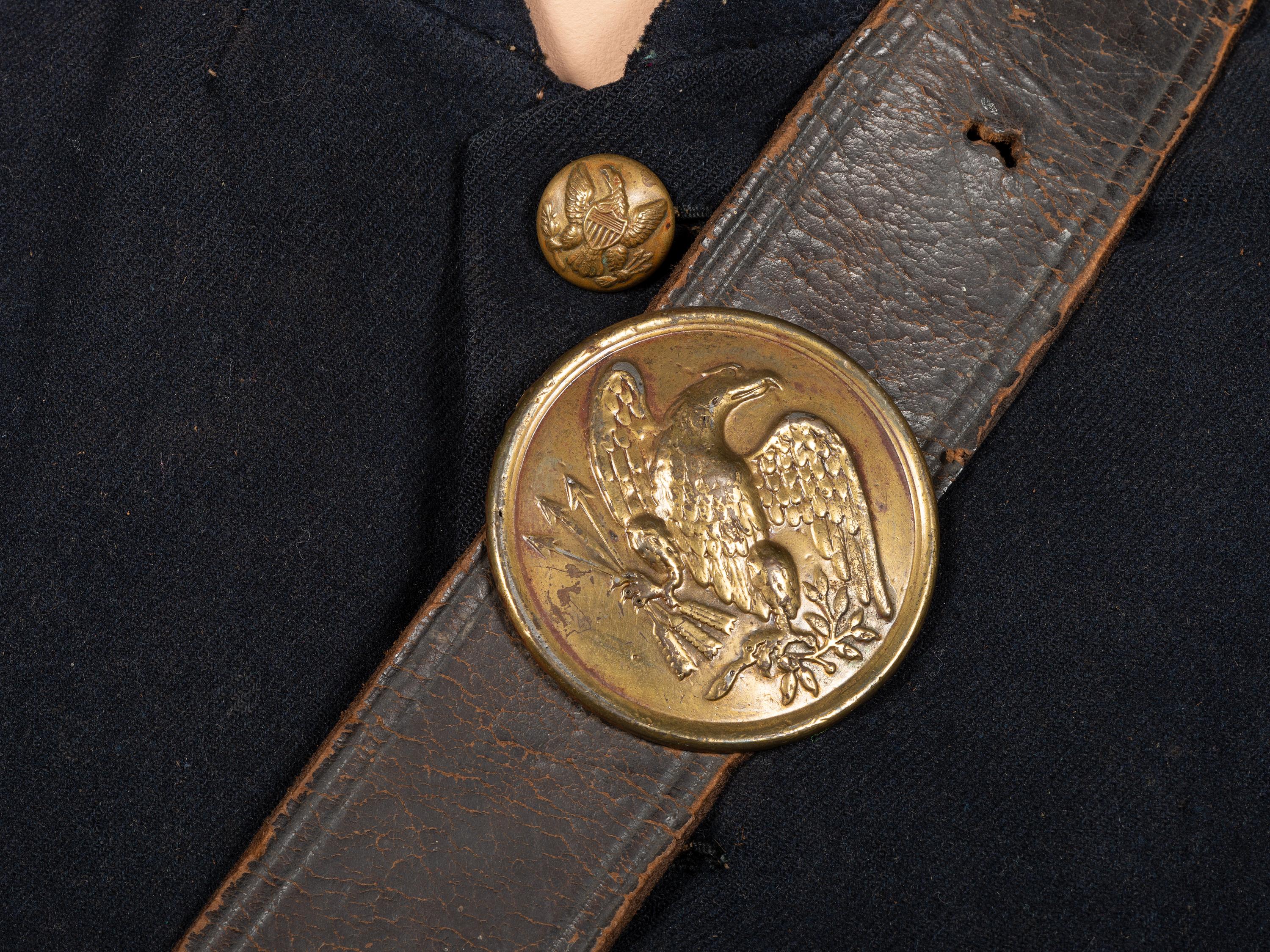 [CIVIL WAR]. A collection of items attributed to Thomas W. Johnson, Co. K, 4th Delaware Infantry, incl. frock coat, cap, belt rig, and cartridge box.